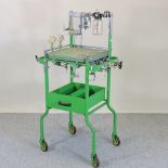 A 1950's green painted metal anaesthetist's or dentist's table,