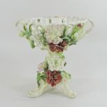 A continental porcelain basket, on a figural stand,