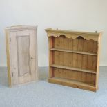 An antique pine hanging corner cabinet, together with a pine plate rack,