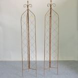 A pair of metal folding lattice garden spires,