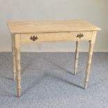 An antique pine side table, with a single drawer,