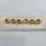 A set of Guinness advertising buttons,