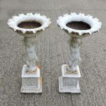 A pair of white painted cast iron garden urns, with cherub supports,