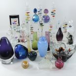 A collection of coloured glass to include vases, paperweights and thermometers,