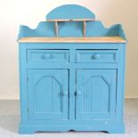 An antique pine and blue painted chiffonier, with a shaped gallery back,