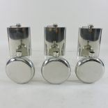 A collection of six stainless steel hip flasks