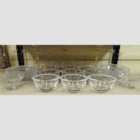 A shelf of glassware, to include bowls and candlesticks,
