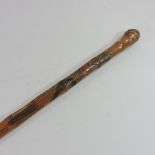 An early 20th century Chinese bamboo sword stick, with carved decoration,