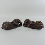 A pair of early 20th century Chinese carved wooden dogs of fo,