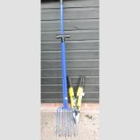 A pair of long and short manure forks, together with a power pruner,