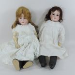 An Armand Marseille bisque headed doll, with brown hair, stamped 370, AM-5-DEP, 55cm tall,