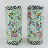 A pair of Chinese pottery cylinder shaped vases,