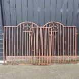 A pair of painted iron garden gates,