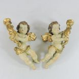 A pair of early 20th century Italian polychrome painted cherub sconces,
