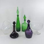 A collection of coloured glass decanters,