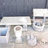 A reconstituted stone bench, 105cm, together with a water well,