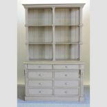 A French grey painted dresser, the plate rack with turned columns, with drawers and cupboards below,