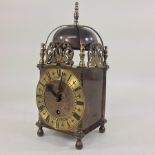 A brass cased Smiths lantern clock,