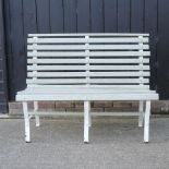A cast iron and cream painted wooden slatted garden bench,