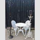 A white painted garden table, 69cm, with two matching chairs,