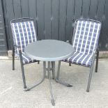 A modern black metal circular garden table, 71cm diameter, together with a pair of chairs,