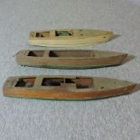 A mid 20th century pond boat, together with two others,