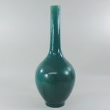 A late 19th century turquoise glazed pottery bottle vase, of Linthorpe style,