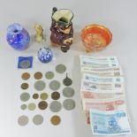 A collection of coins, banknotes,