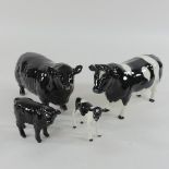 A Beswick model of an Aberdeen Angus bull, 12cm tall, with calf, together with a Beswick bull,