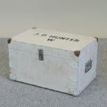 A white painted wooden box, inscribed J.P.