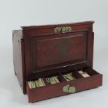 A mid 20th century Chinese mahjong set, with bone and bamboo tiles, in a wooden box,