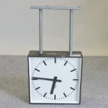 A hanging station clock, with a white dial,