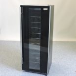 A Haier wine fridge, with a glass door,