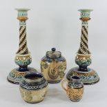 A pair of Doulton Lambeth pottery candlesticks, 29cm tall,