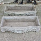 A pair of reconstituted stone garden troughs,