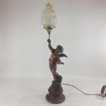 A 19th century spelter figural cherub table lamp, with a glass shade,