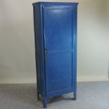 An early 20th century blue painted pine cabinet,