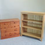 A modern pine chest of drawers, together with a light oak open bookcase,