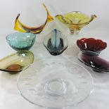 A collection of various coloured glass bowls and centrepieces,