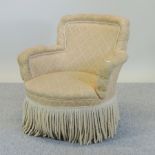 A Victorian yellow upholstered tub shaped armchair,