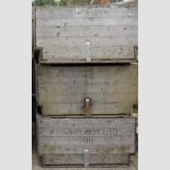 A set of three large wooden apple crates,