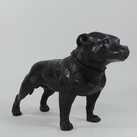 A bronze statue of a Staffordshire bull terrier,