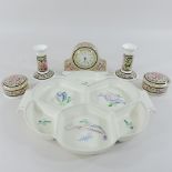 A Wedgwood Clio pattern mantel clock, 11cm tall, a pair of candlesticks and trinket dishes,