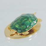 An Asprey brass and enamel paper clip, in the form of a tortoise, 7.