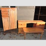 A modern pine twin pedestal desk, together with a pine cabinet and coffee table,