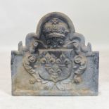 A cast iron fire back, relief decorated with a crown,