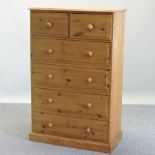 A large pine chest of two short over four long drawers,