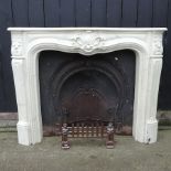 A cast iron fire insert, with a marble resin fire surround,