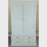 A modern grey painted pine double wardrobe, with drawers beneath,