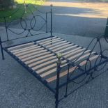 A metal double bedstead, from John Lewis,